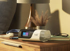 ResMed AirSense 11 AutoSet CPAP on a bedside nightstand